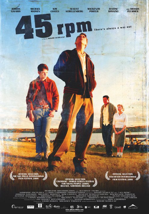 Four people standing in a field