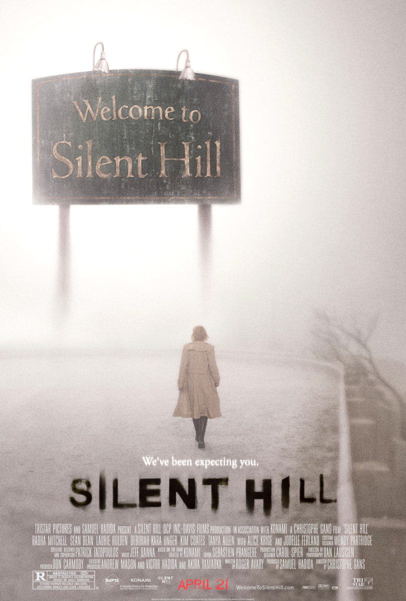 Person walking towards Silent Hill sign