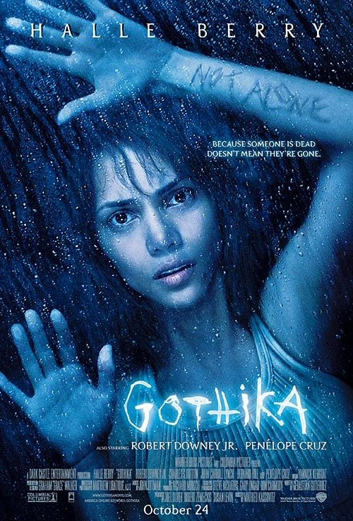Woman trapped behind glass, "Gothika" movie poster